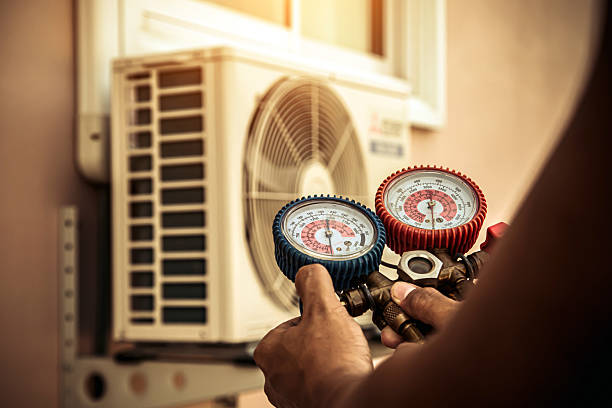 Professional Air Conditioning Service technician working in Bingen, WA